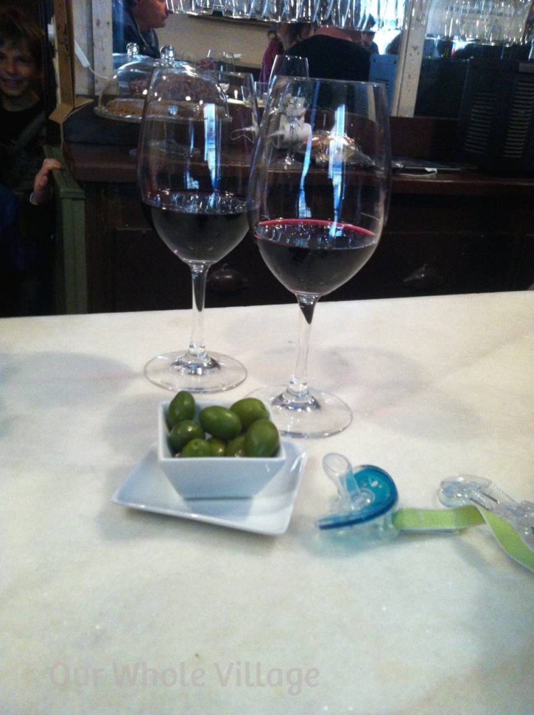 Olives, or other nibbles, are almost always included gratis when you order wine or beer in Madrid. You can sip while the kids nibble -- win-win!