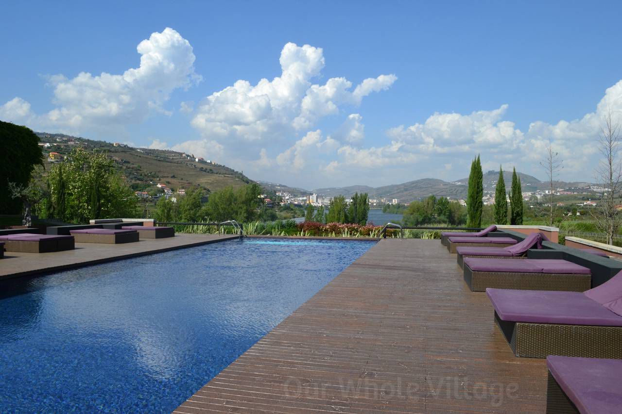 The beautiful infinity pool at Aquapura. Grapevines and the River Douro are the perfect backdrop.